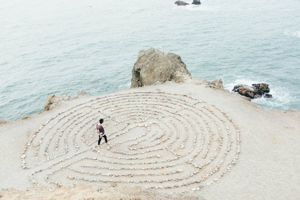Image of a person navigating a maze on a beach