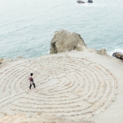 Image of a person navigating a maze on a beach