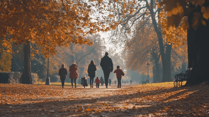 People walking in an English park in autumn People walking in an English park in autumn